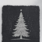 Snowy Christmas tree design on square slate, one of the four coasters in the mixed set (product mockup)