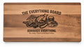 Wood cutting board laser engraved with The Everything Board, a pile of foods and the line Seriously. Everything. (real photo of our work)