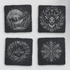 Four square slate coasters engraved with Santa's sleigh, a reindeer, a Merry Christmas wreath and a snowflake (product mockup)