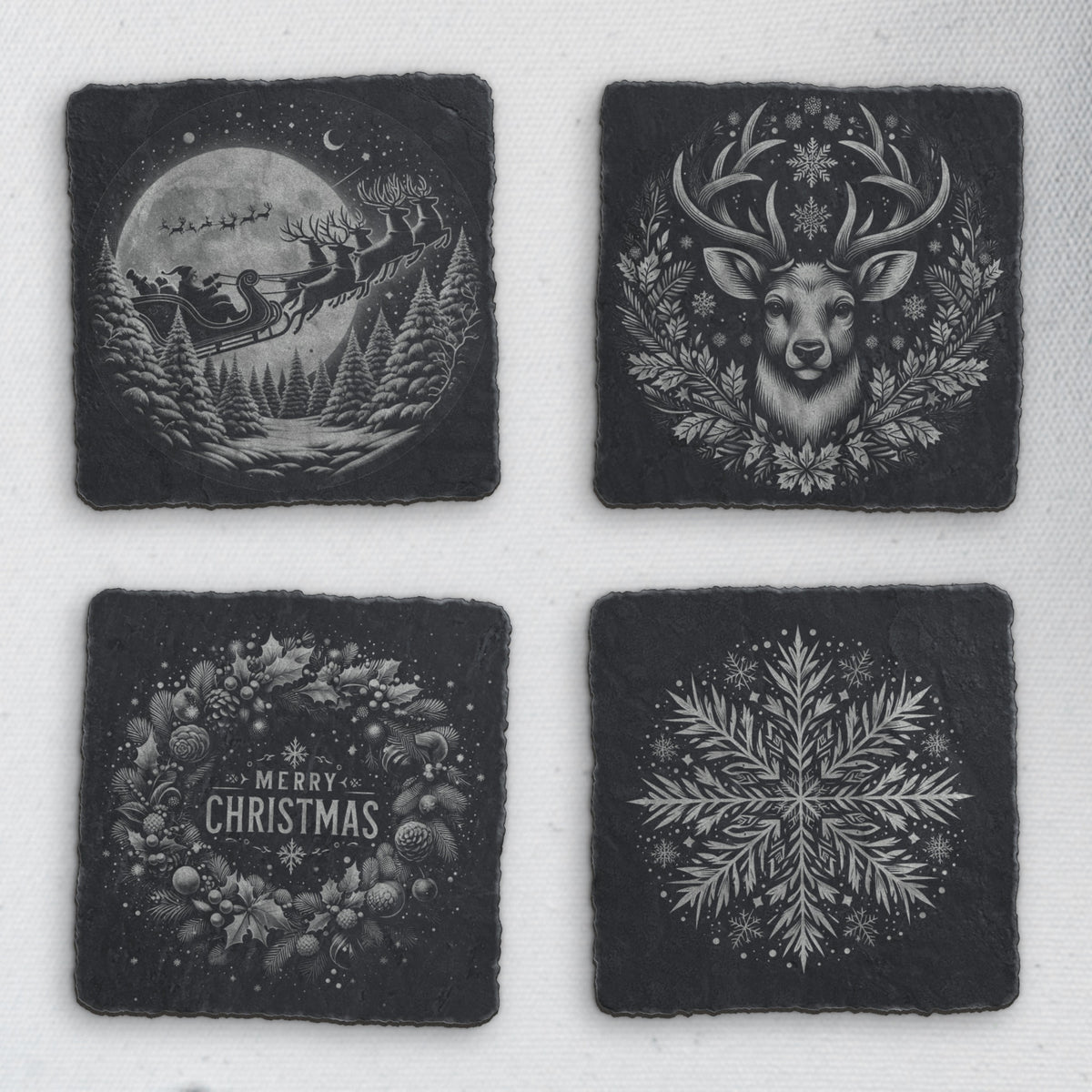 Four square slate coasters engraved with Santa's sleigh, a reindeer, a Merry Christmas wreath and a snowflake (product mockup)