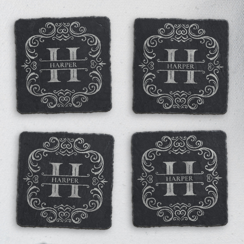 Four square slate coasters engraved with a split-letter H monogram and the sample name Harper (product mockup)