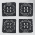Four square slate coasters engraved with a split-letter H monogram and the sample name Harper (product mockup)