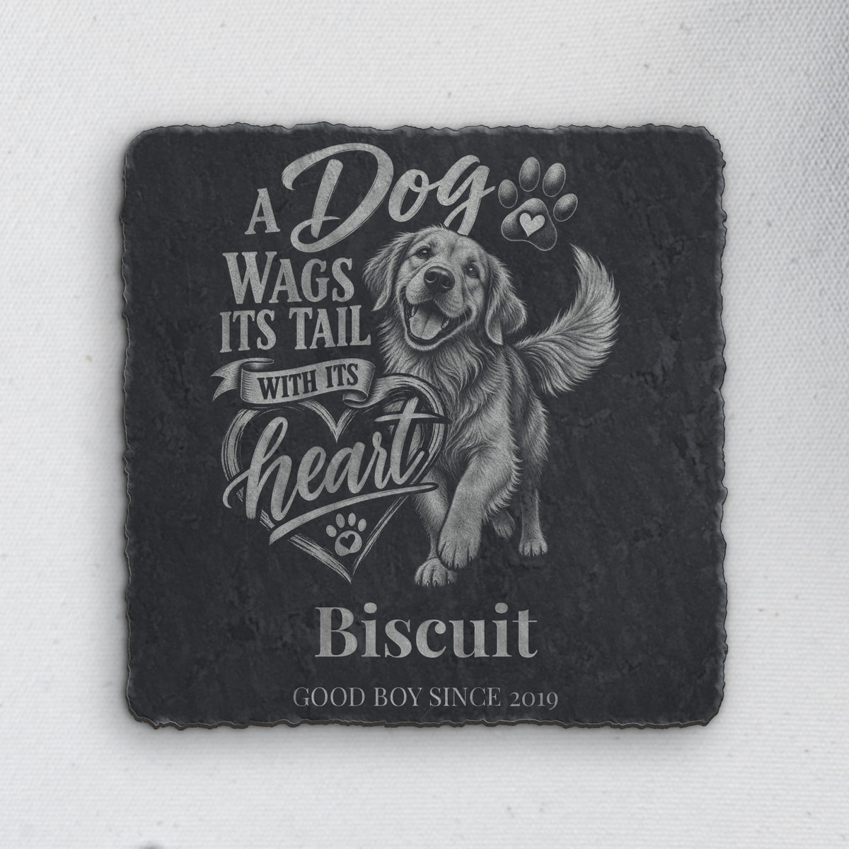 8x8 slate sign engraved with a happy golden retriever, the quote A Dog Wags Its Tail With Its Heart, and sample name Biscuit (product mockup)